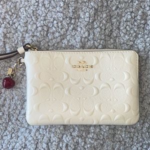 Coach wristlet with removable apple charm